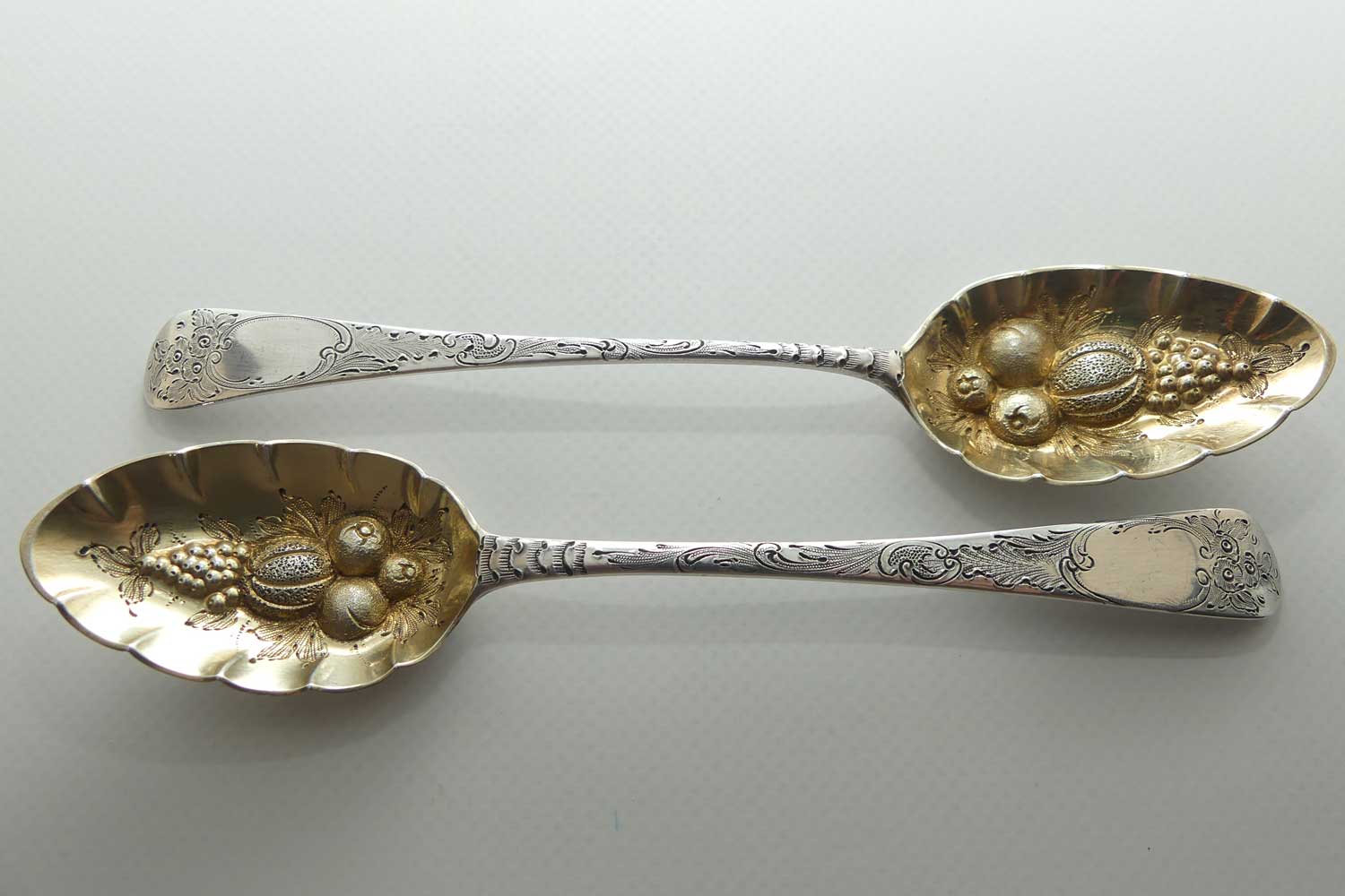 Pair Georgian era GeoIII Sterling Silver berry spoons with gilt wash bowls | London 1791 and 1795 | different makers