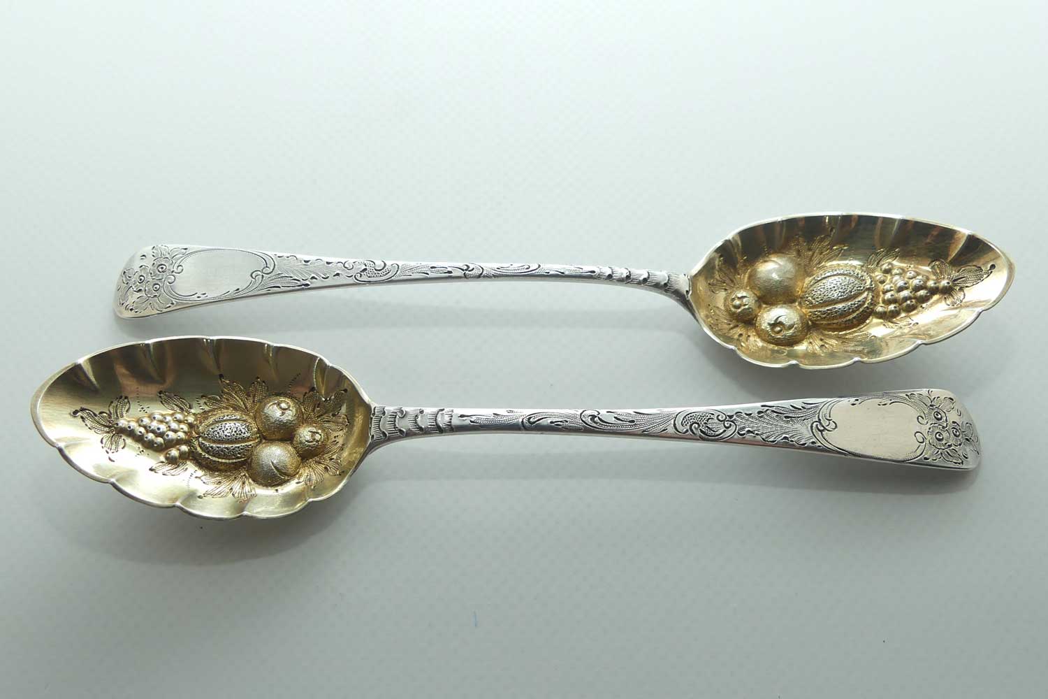 Pair Georgian era GeoIII Sterling Silver berry spoons with gilt wash bowls | London 1791 and 1795 | different makers