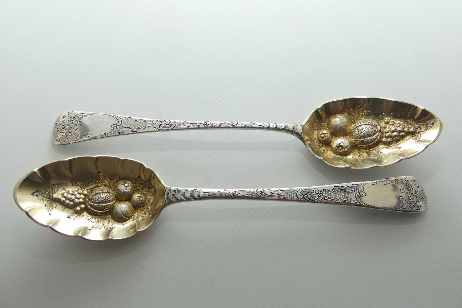 Pair Georgian era GeoIII Sterling Silver berry spoons with gilt wash bowls | London 1791 and 1795 | different makers