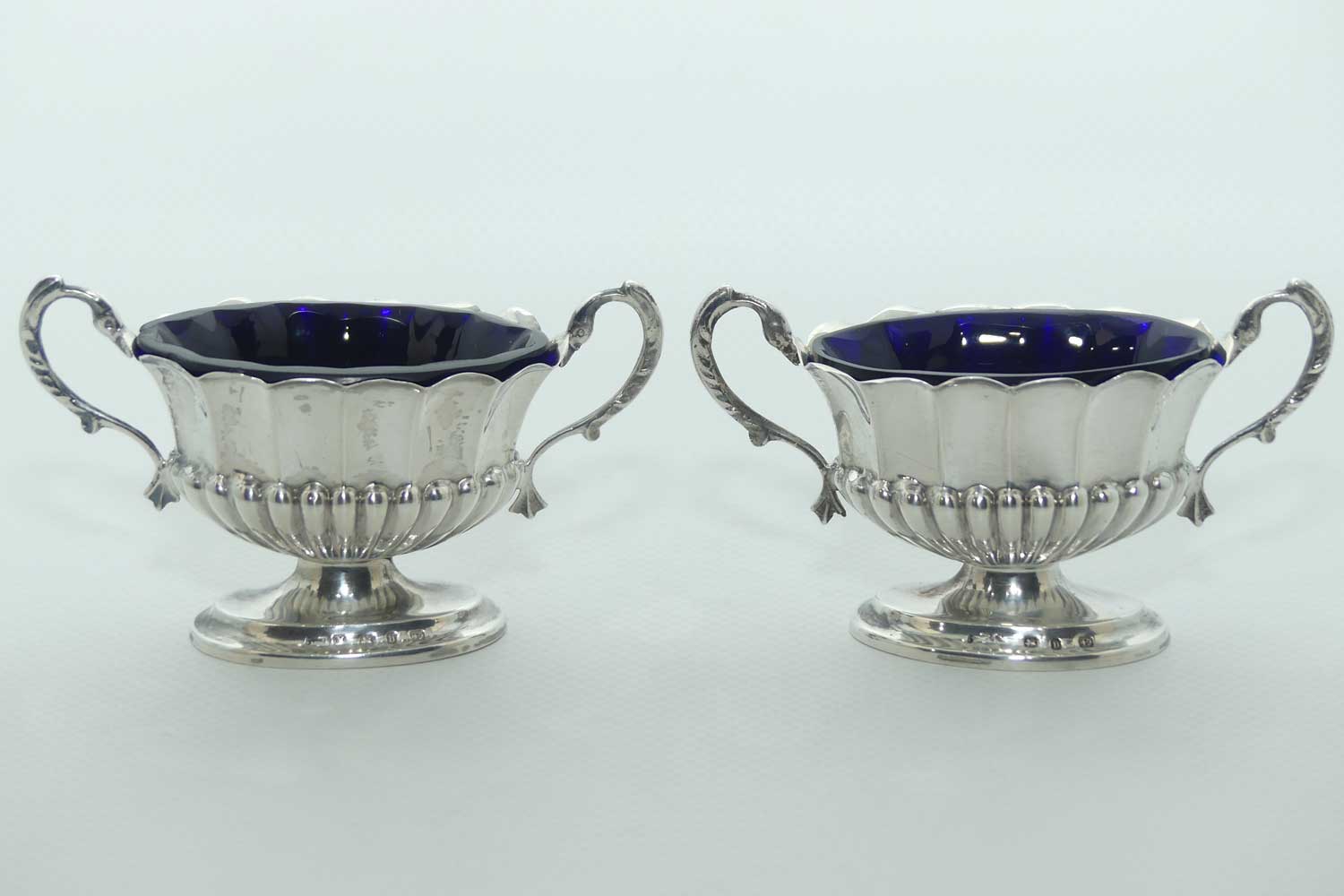Victorian era Sterling Silver open salts in Campagna vase form with blue glass liners | Birmingham 1876