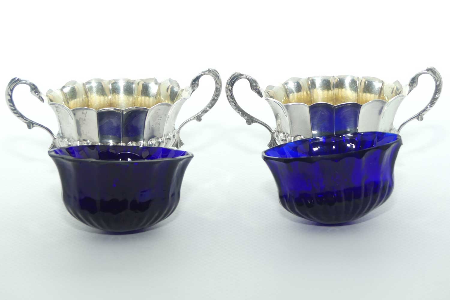 Victorian era Sterling Silver open salts in Campagna vase form with blue glass liners | Birmingham 1876