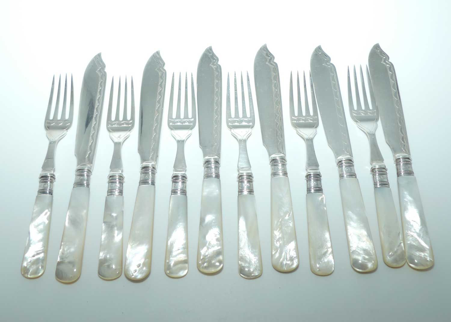 Edwardian era Solid Mother of Pearl handles, Sterling Silver Ferrules and EPNS blades set of 6 fish eaters