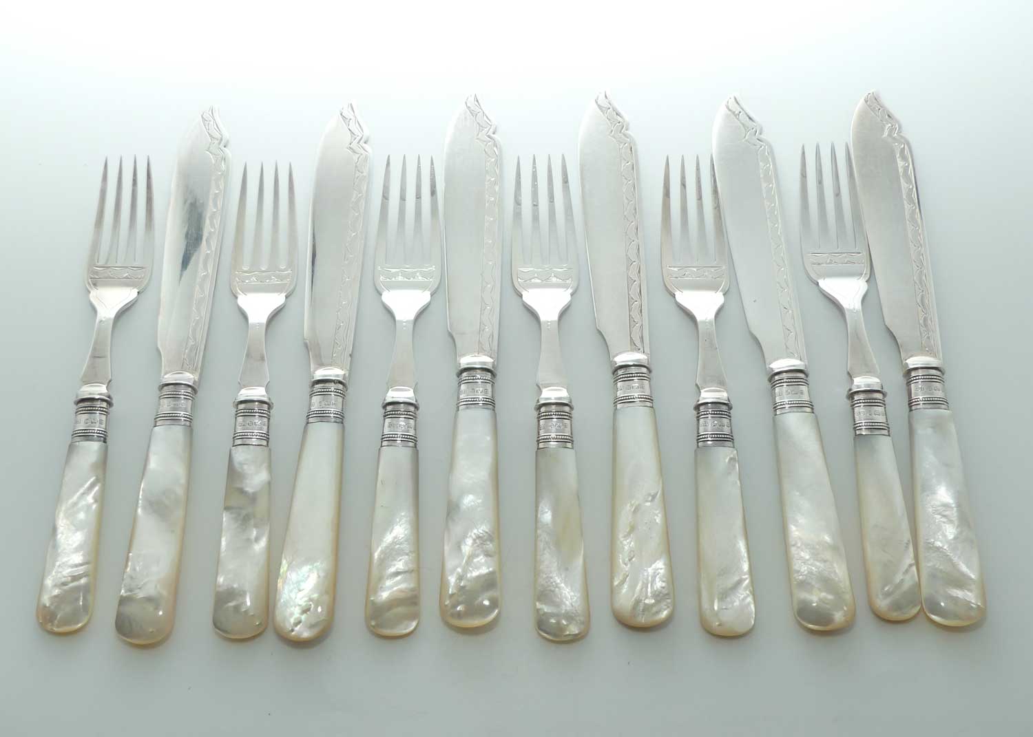 Edwardian era Solid Mother of Pearl handles, Sterling Silver Ferrules and EPNS blades set of 6 fish eaters