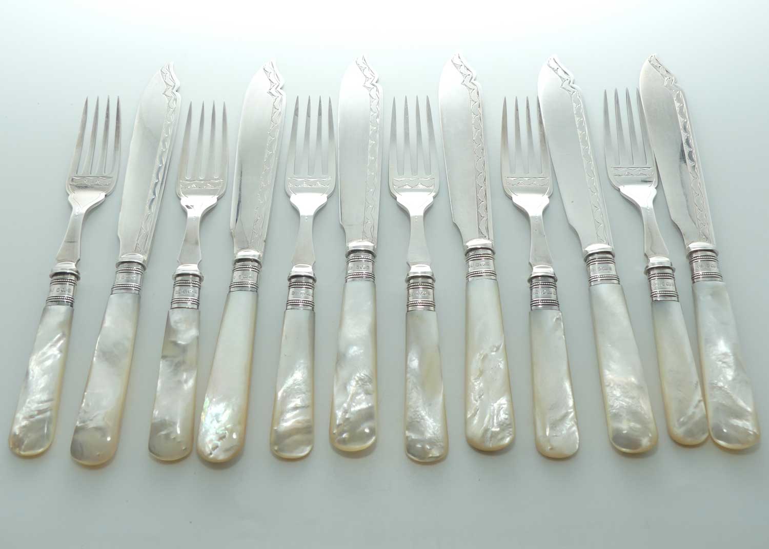 Edwardian era Solid Mother of Pearl handles, Sterling Silver Ferrules and EPNS blades set of 6 fish eaters