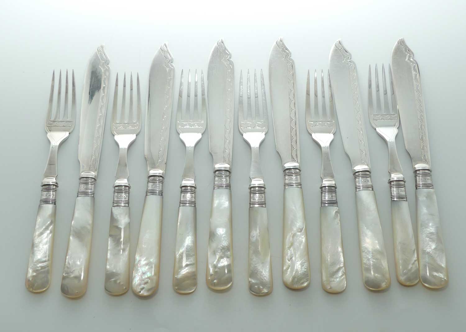 Edwardian era Solid Mother of Pearl handles, Sterling Silver Ferrules and EPNS blades set of 6 fish eaters