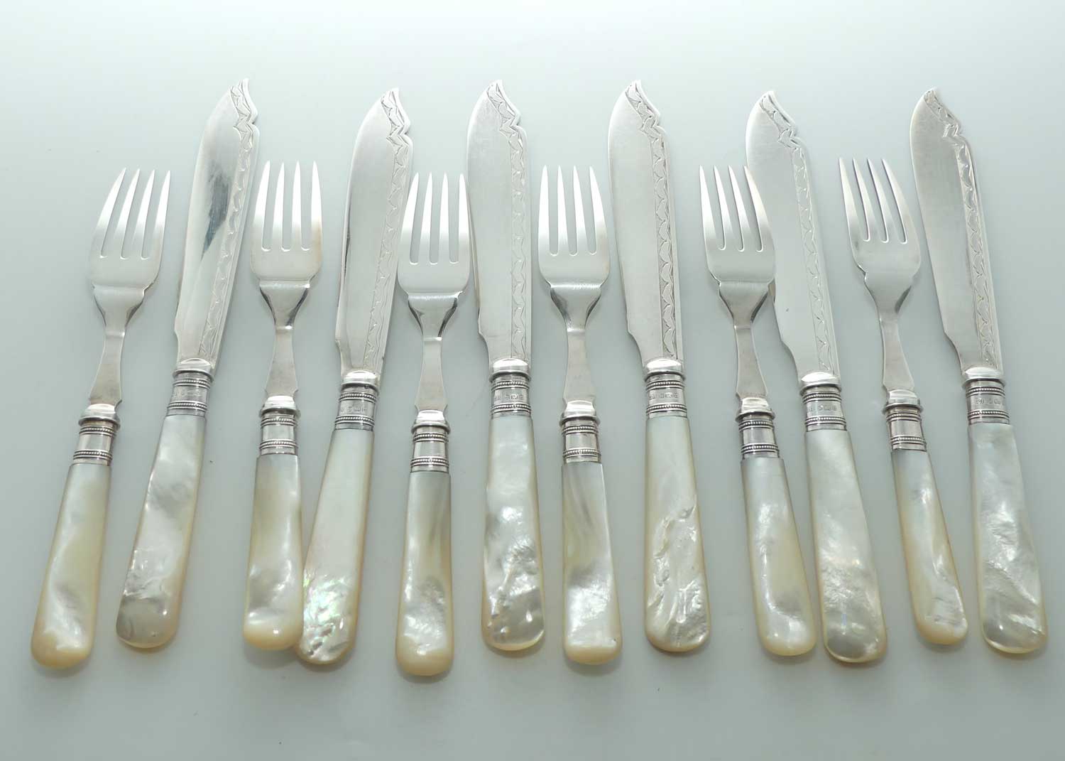 Edwardian era Solid Mother of Pearl handles, Sterling Silver Ferrules and EPNS blades set of 6 fish eaters
