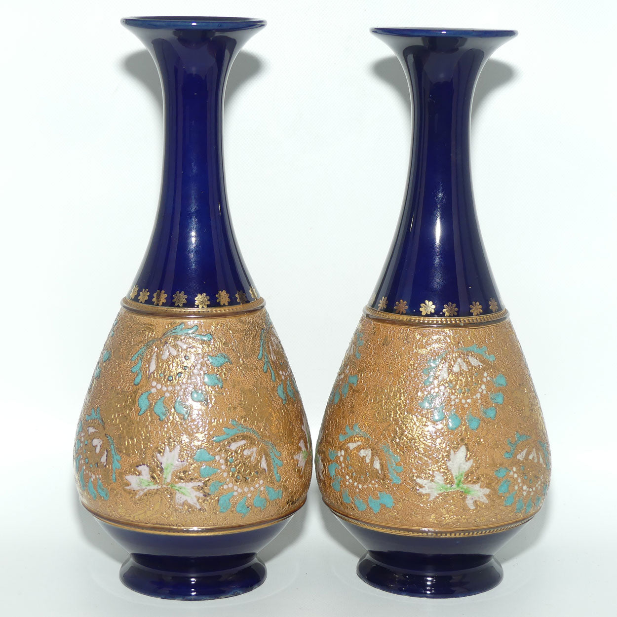 Doulton Slaters stoneware pair of narrowneck bulbous vases with blue, white & green enamelling and gilt highlights (stamped 672)
