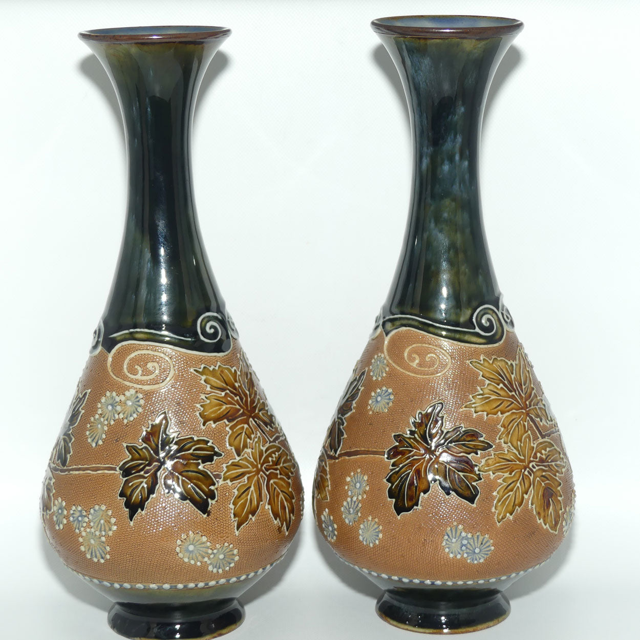 Royal Doulton pair of stoneware vases with applied foliage and scrolling (stamped 6767)