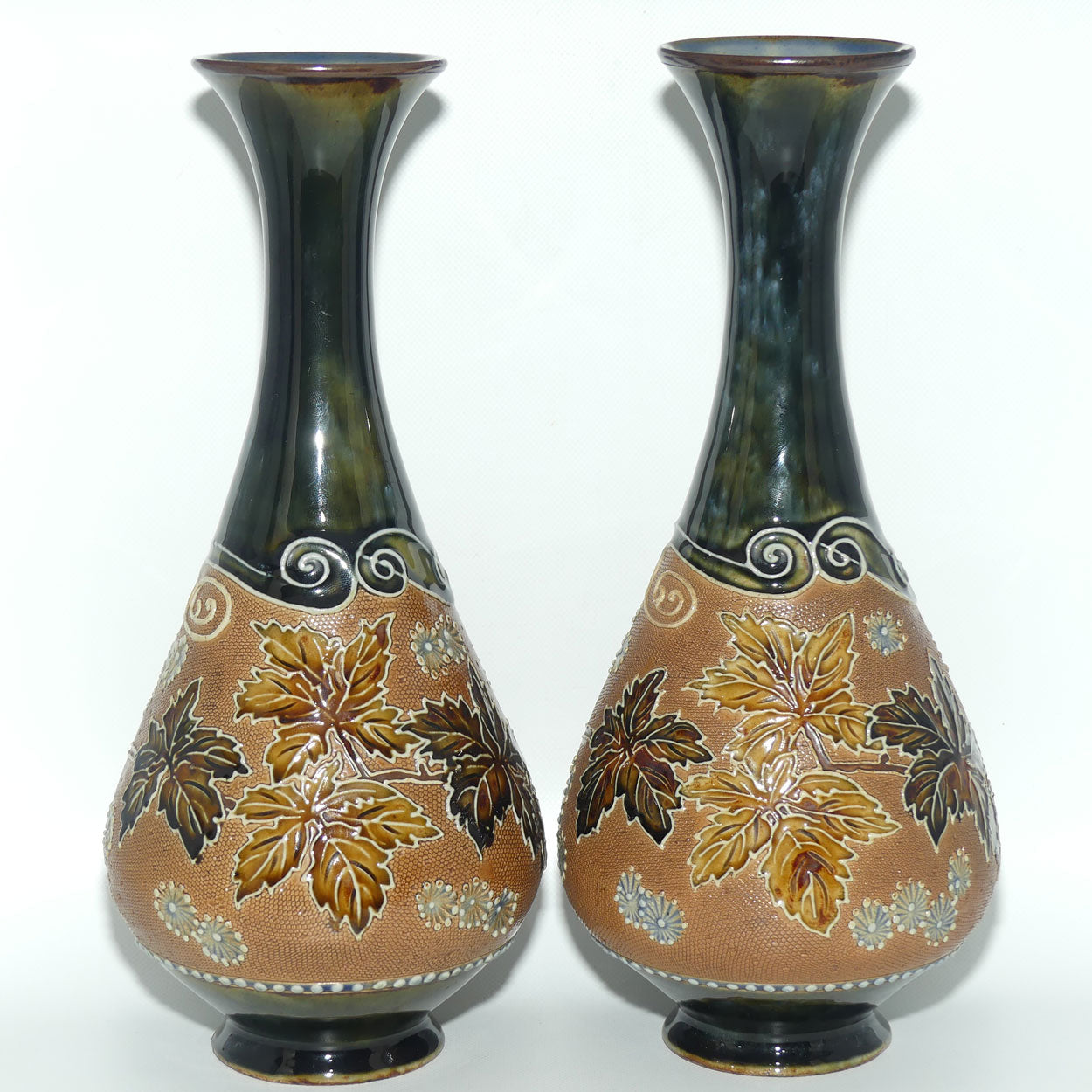 Royal Doulton pair of stoneware vases with applied foliage and scrolling (stamped 6767)