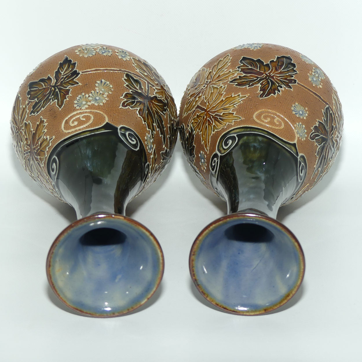 Royal Doulton pair of stoneware vases with applied foliage and scrolling (stamped 6767)