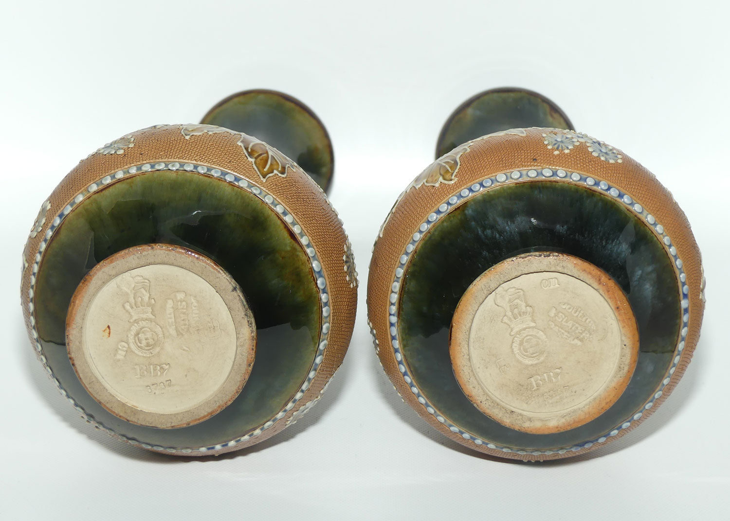 Royal Doulton pair of stoneware vases with applied foliage and scrolling (stamped 6767)