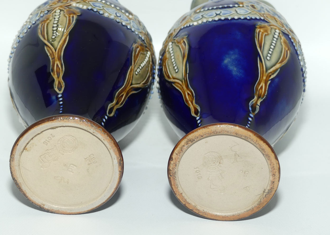 Royal Doulton pair of stoneware ewers with applied flowers, hearts and dots (stamped 7018)