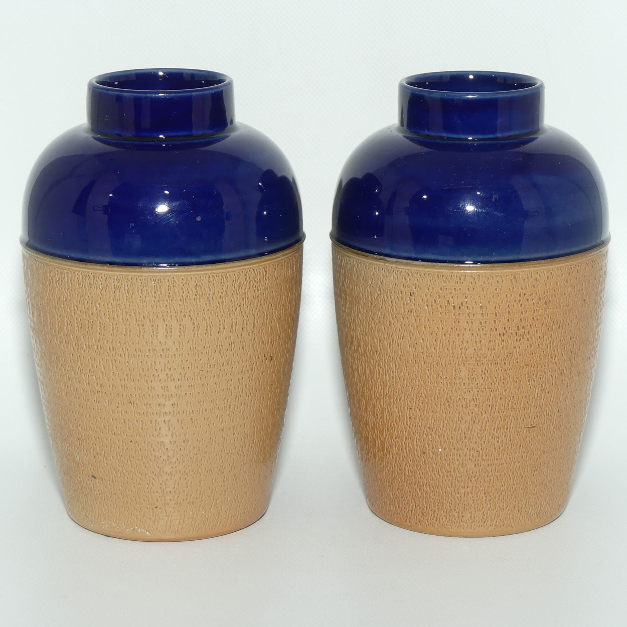 Royal Doulton pair of small stoneware vases with stippled finish | Blue tops | 7360