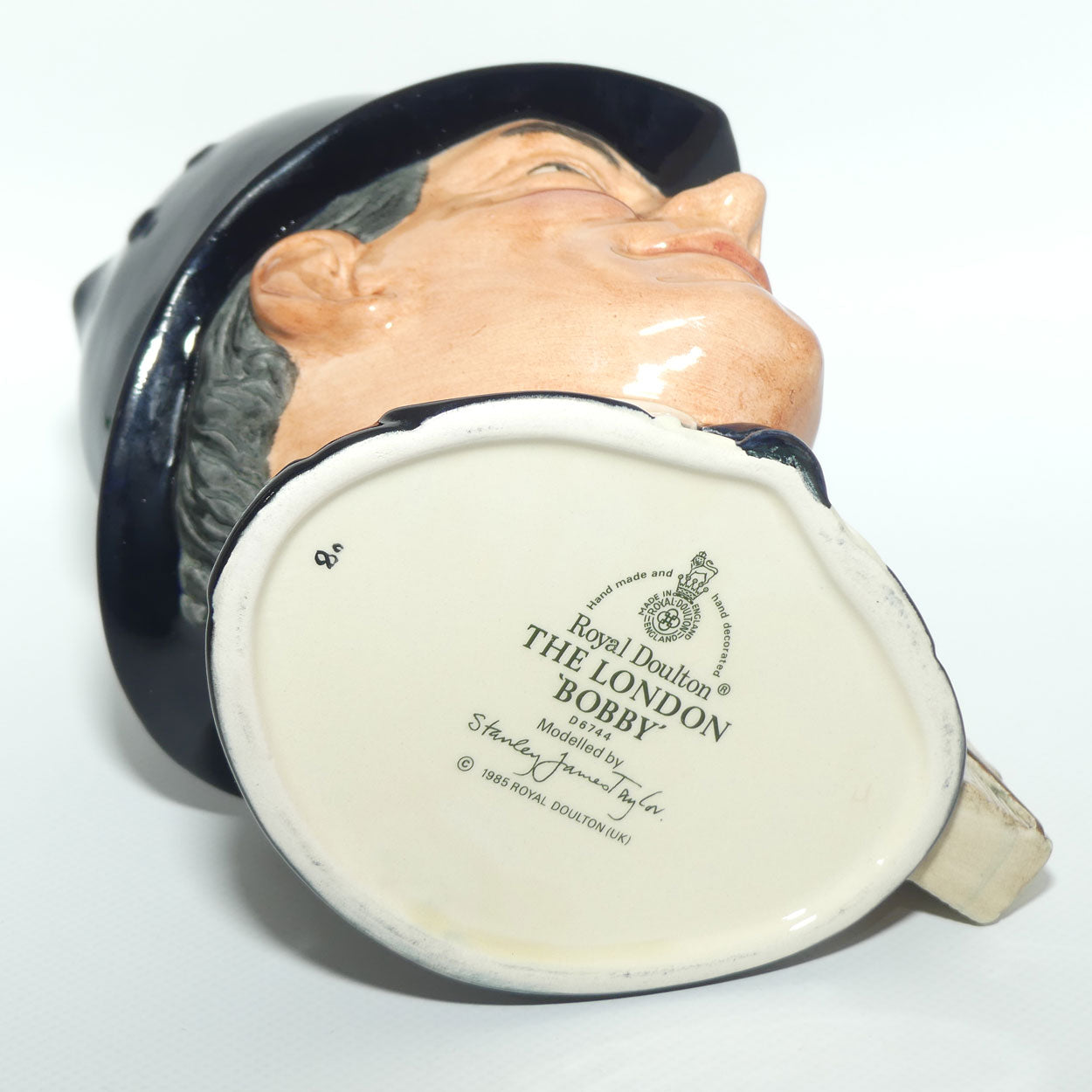D6744 Royal Doulton large character jug London Bobby | Embossed Badge
