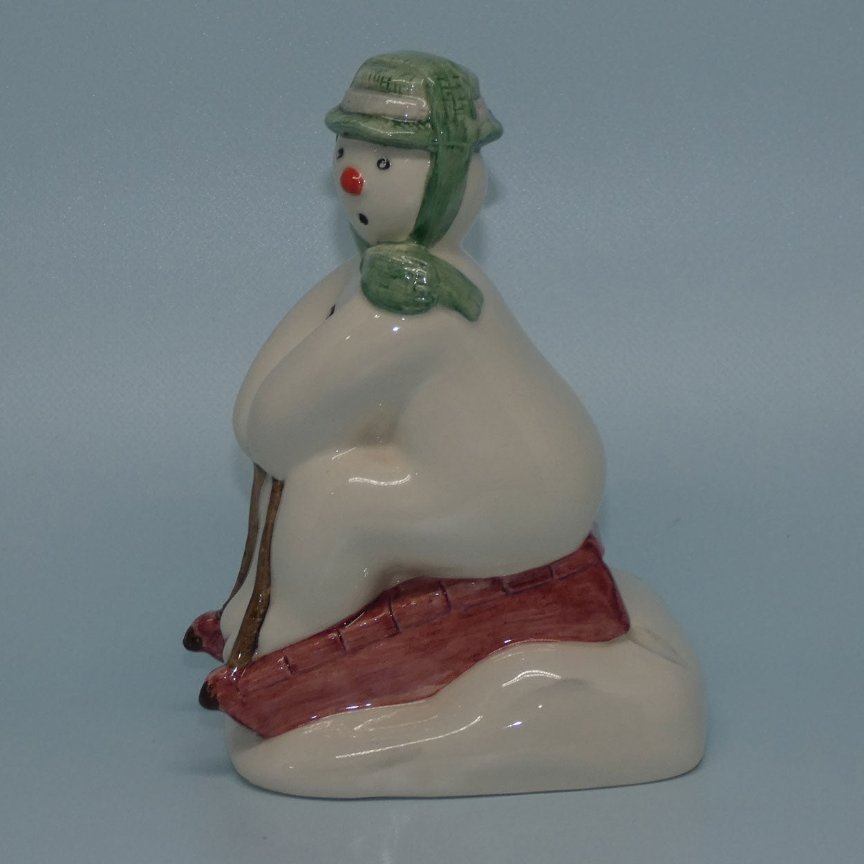 ds20-royal-doulton-snowman-figure-the-snowman-toboganning
