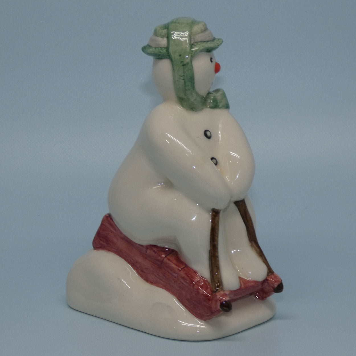 ds20-royal-doulton-snowman-figure-the-snowman-toboganning