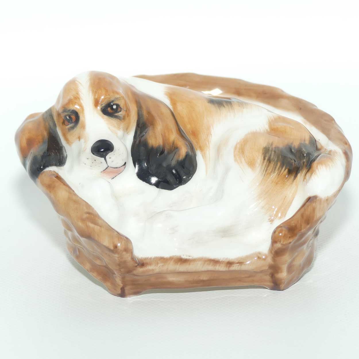 HN2585 Royal Doulton Cocker Spaniel Lying in a Basket