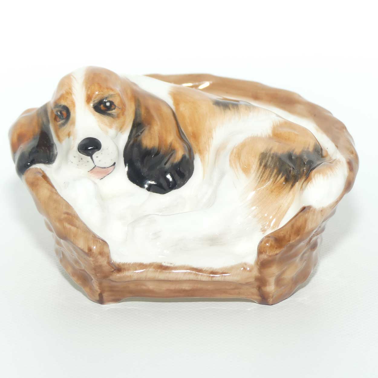 HN2585 Royal Doulton Cocker Spaniel Lying in a Basket