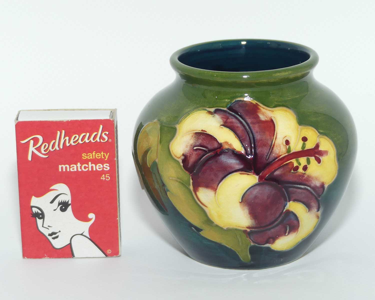 Walter Moorcroft Hibiscus on Green Ground vase | miniature round shape
