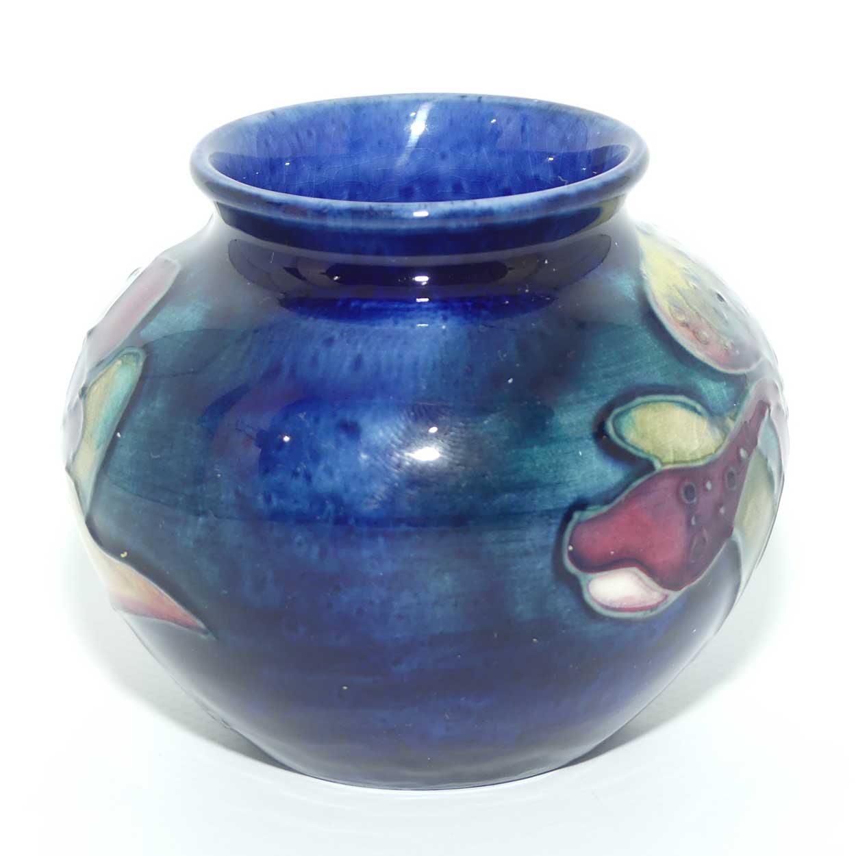 Walter Moorcroft Orchid on Blue Ground vase | miniature round shape