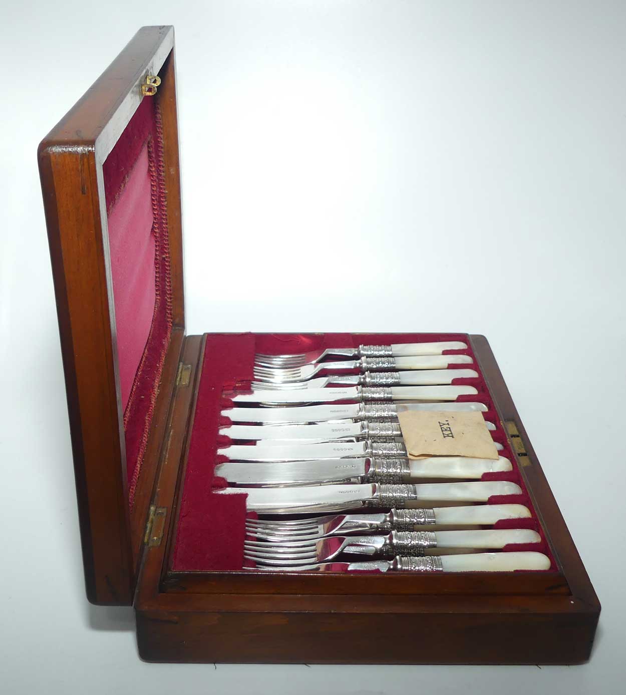 Late Victorian era Solid Mother of Pearl handles and EPNS blades set of 12 fruit set in Walnut canteen