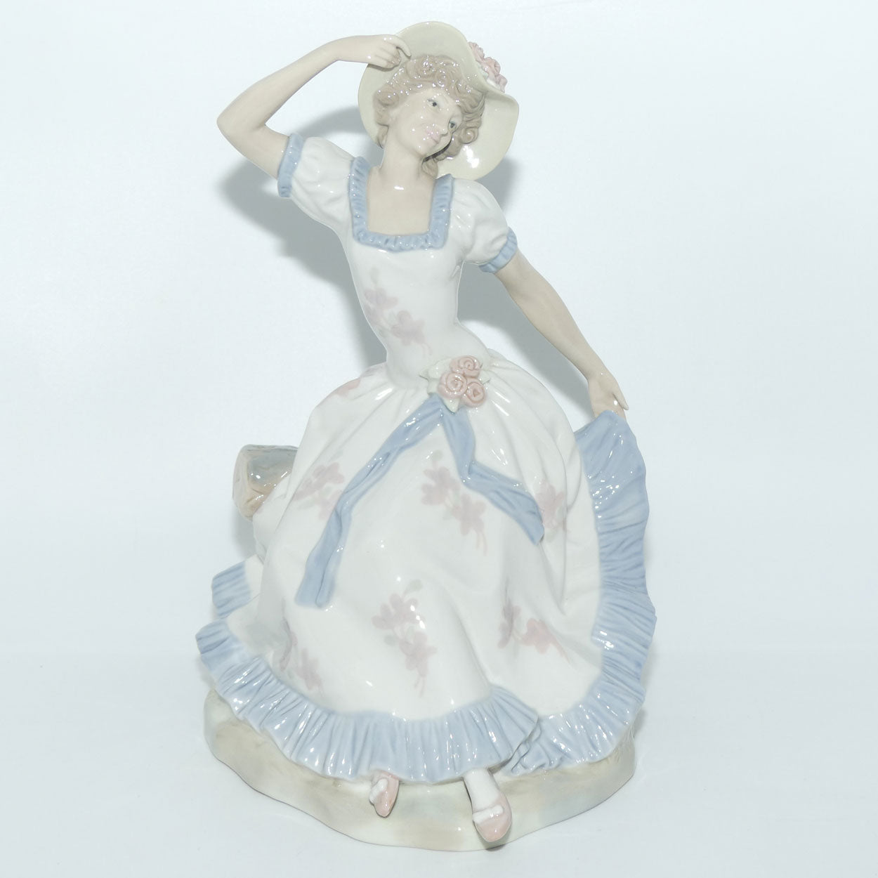 Zaphir | Nao | Lladro figure of a Seated Lady in Sun Hat