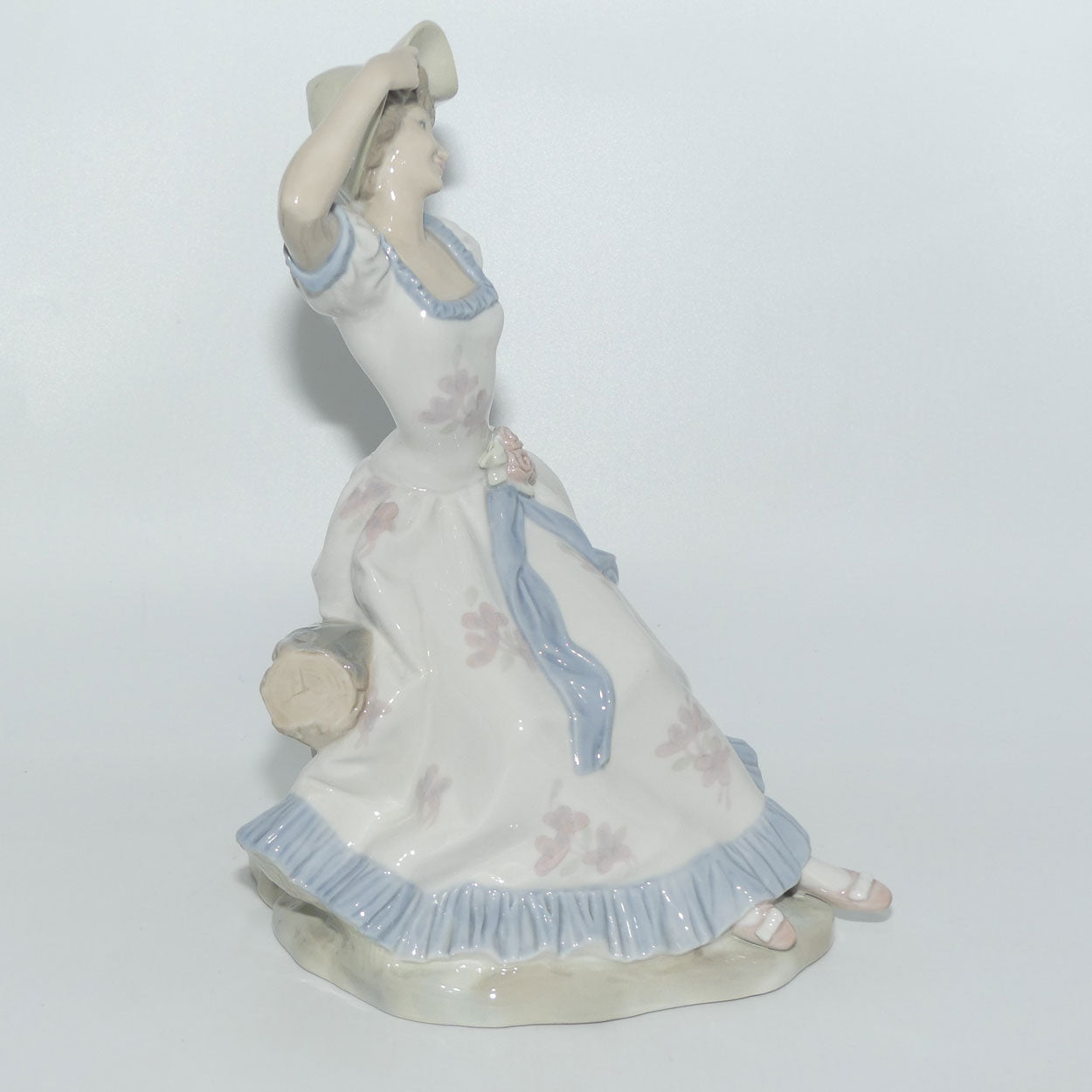 Zaphir | Nao | Lladro figure of a Seated Lady in Sun Hat