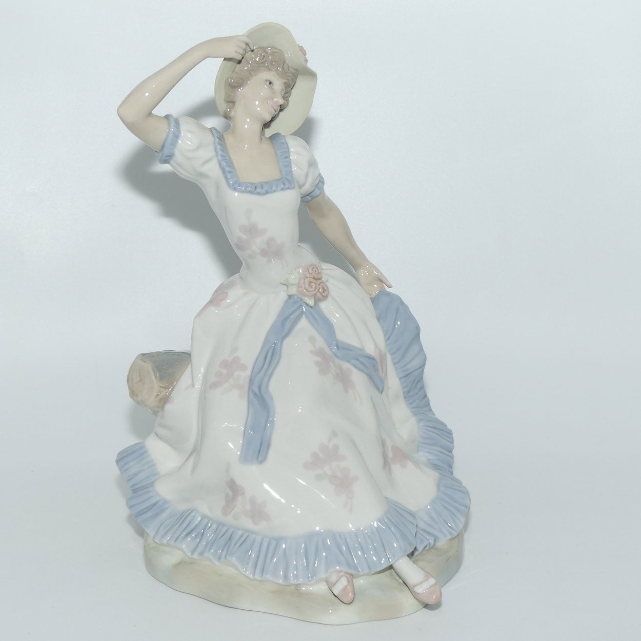 Zaphir | Nao | Lladro figure of a Seated Lady in Sun Hat