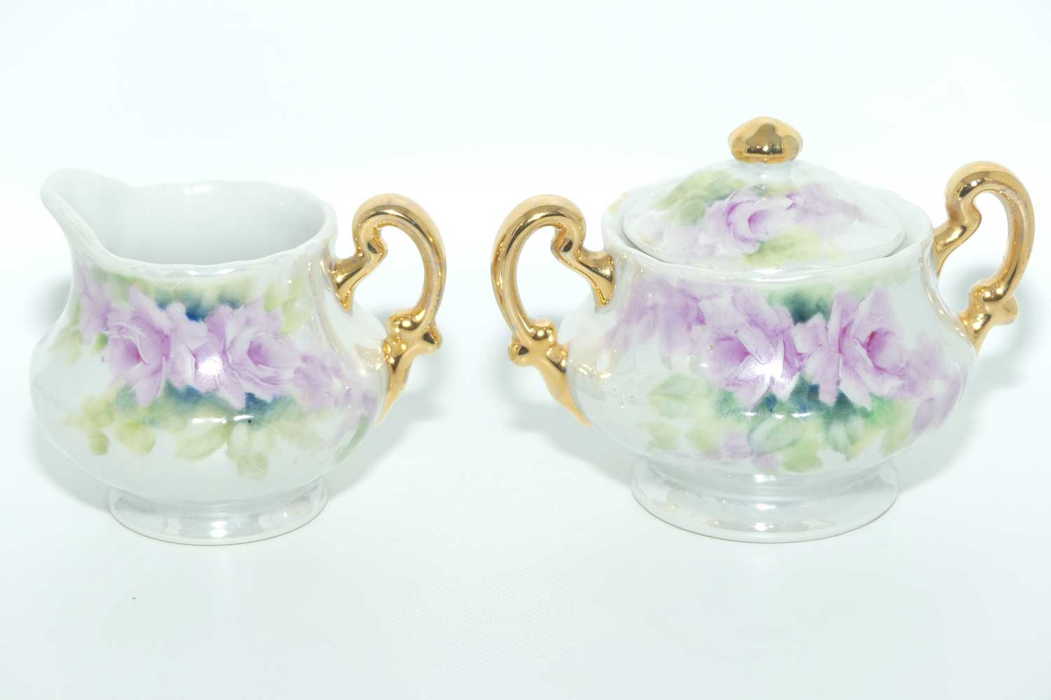 Australian China Painting milk and sugar decorated with Mauve flowers | by Paula Atack 1986