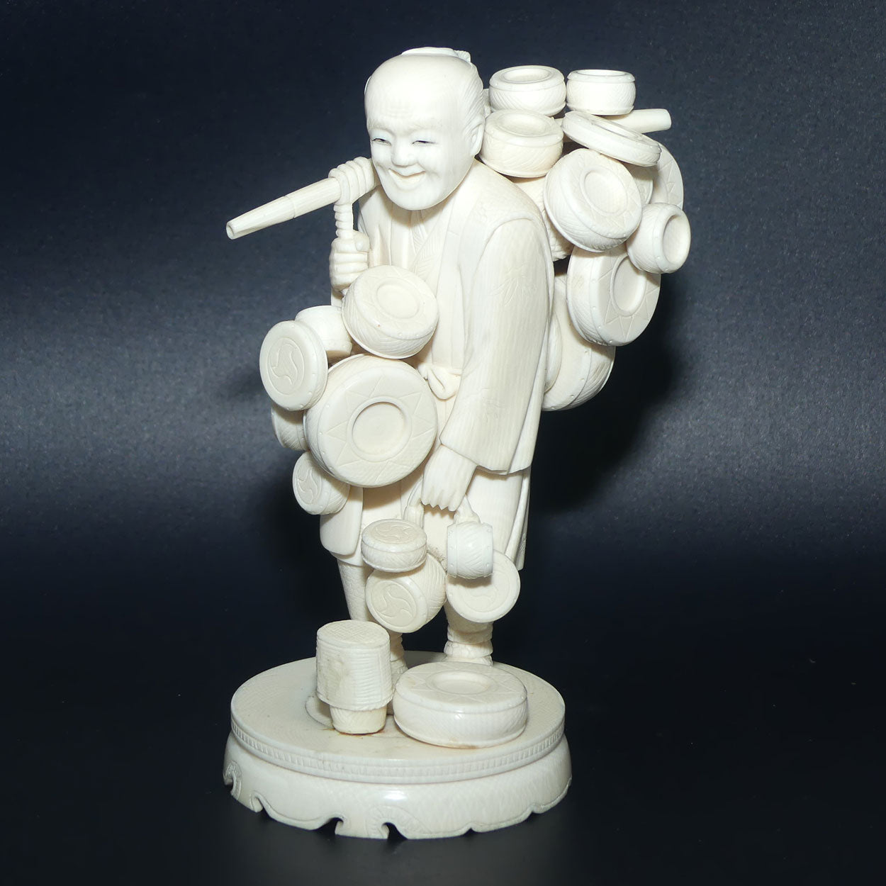 Japanese Carved Ivory Okimono figure on wooden base | Basket Vendor | Meiji period | signed