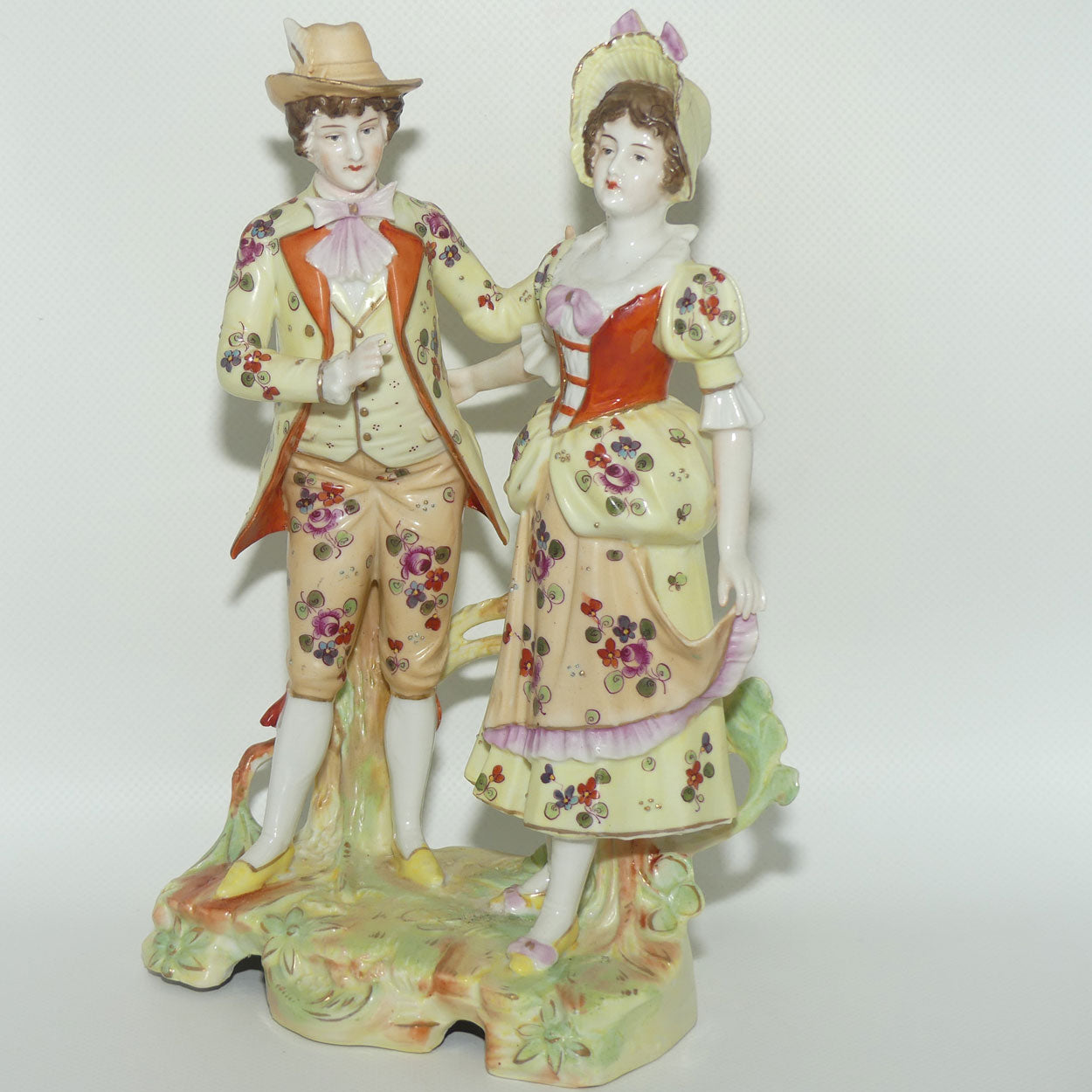 Victorian era Lady and Gent bisque figurine group