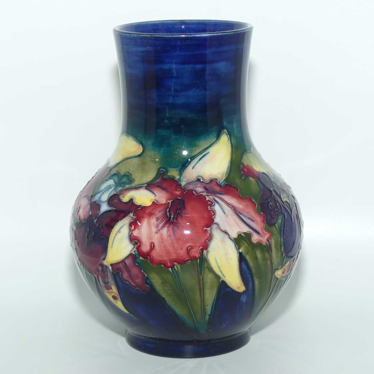 Walter Moorcroft Orchid on Dark Blue Ground bulbous vase