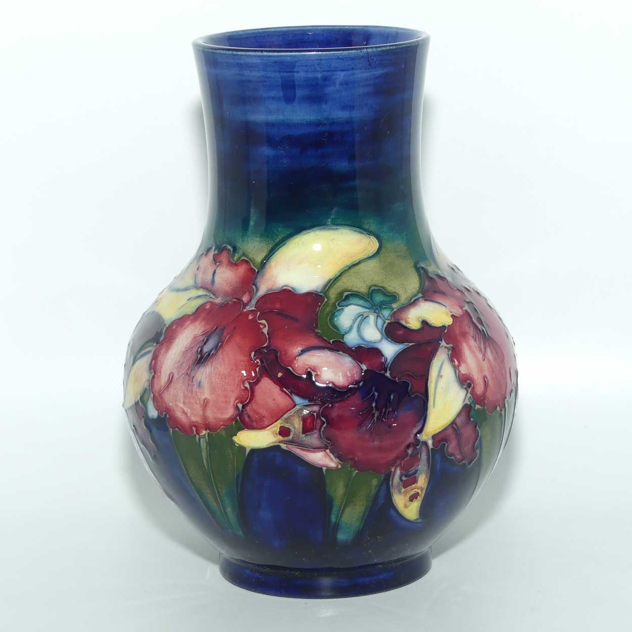 Walter Moorcroft Orchid on Dark Blue Ground bulbous vase