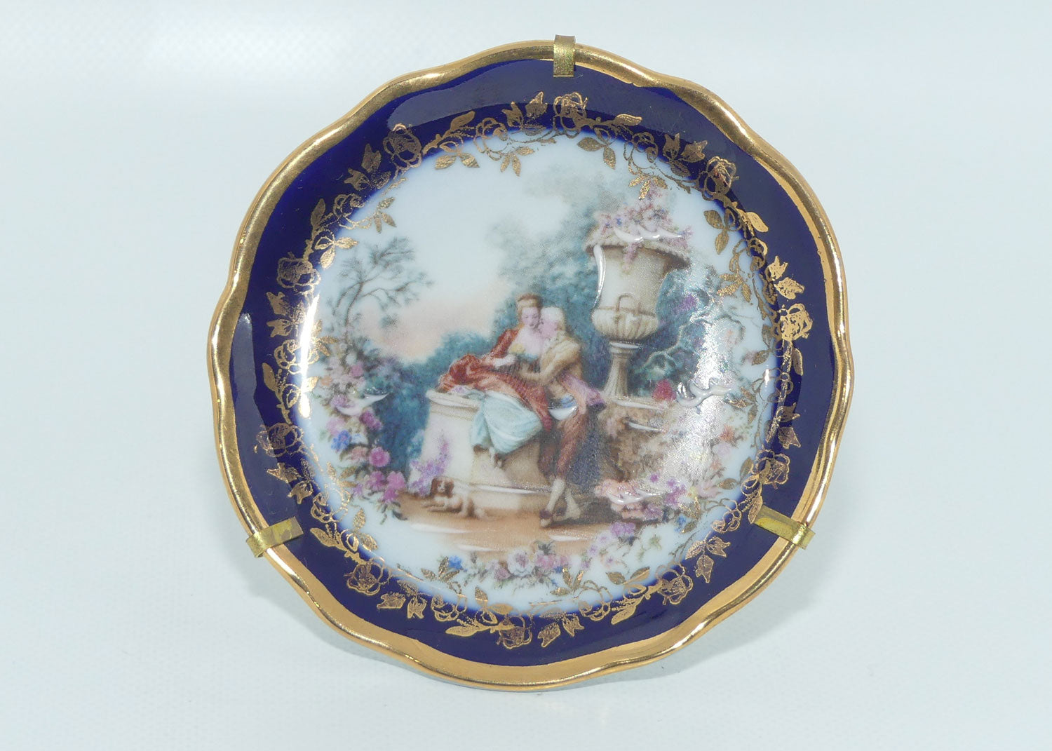 Limoges France Rehausse Main Blue Border courting couple plate in frame