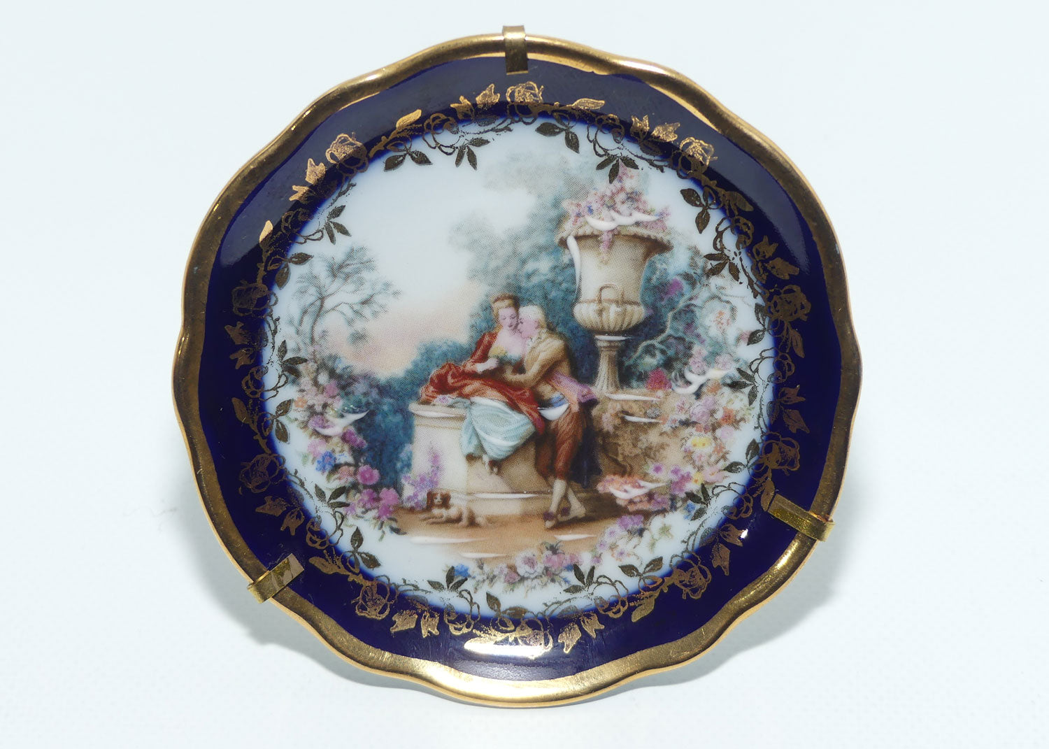 Limoges France Rehausse Main Blue Border courting couple plate in frame