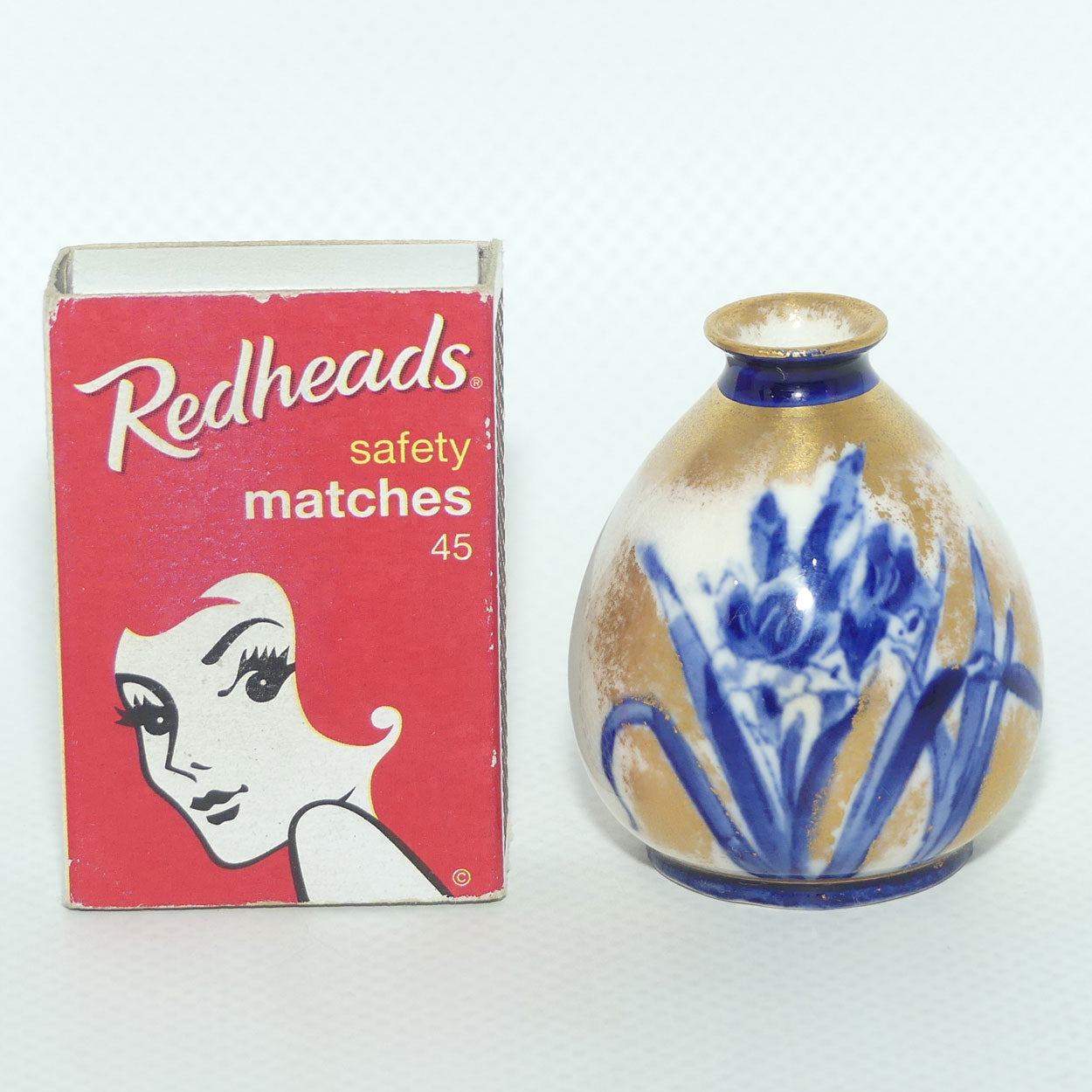 Royal Doulton Flow Blue and Gilt Iris miniature vase