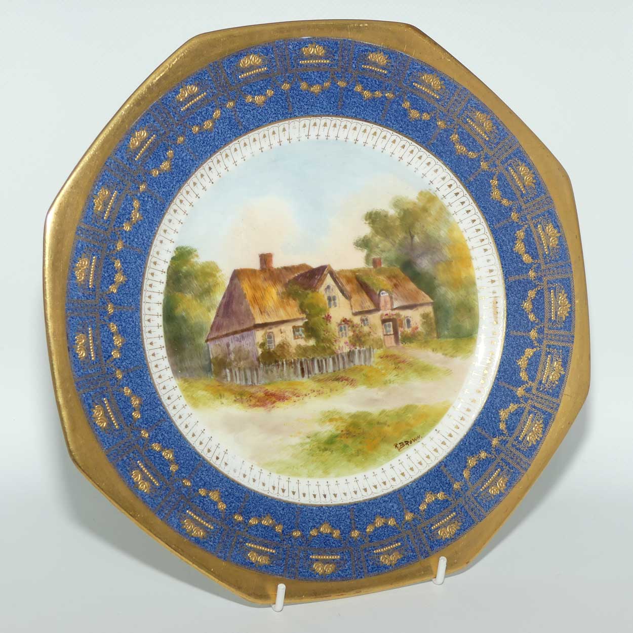 Royal Doulton hand painted and gilt English Thatched Cottage octagonal shape plate | signed R Brown
