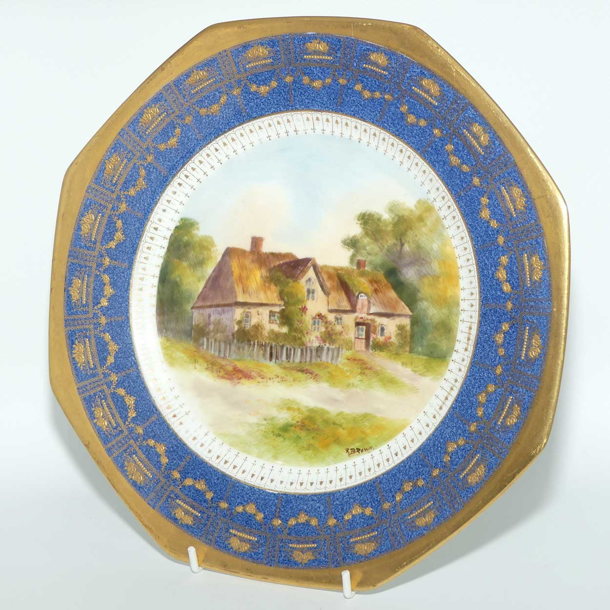 Royal Doulton hand painted and gilt English Thatched Cottage octagonal shape plate | signed R Brown
