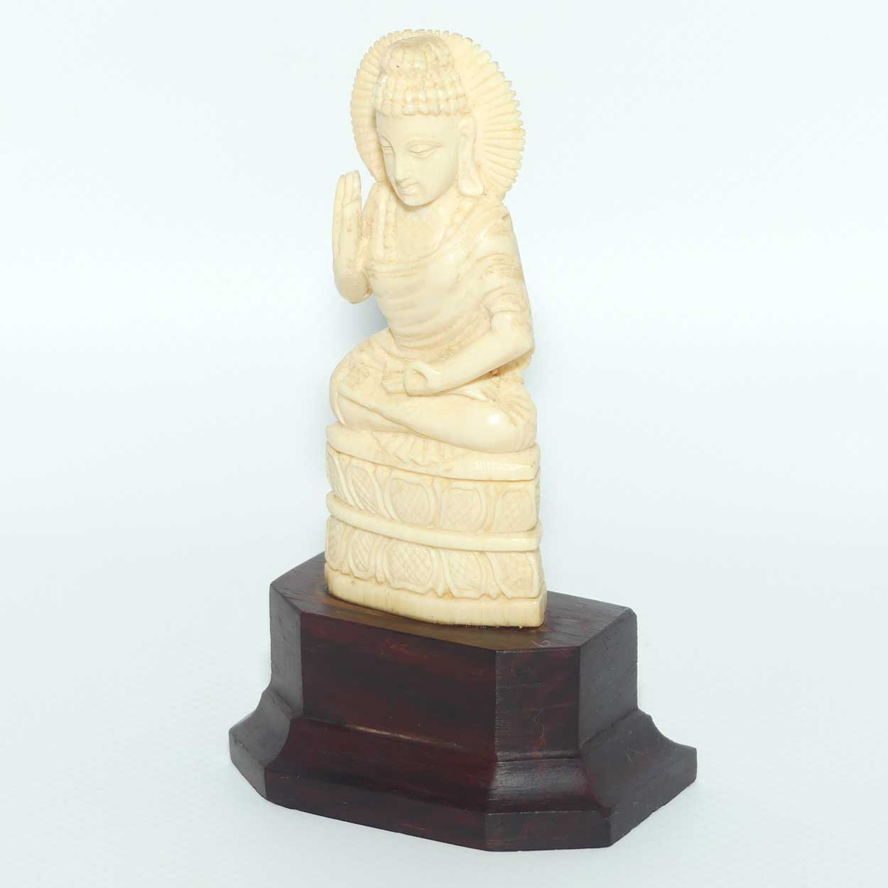 Finely carved Carved Ivory Buddha on Rosewood stand