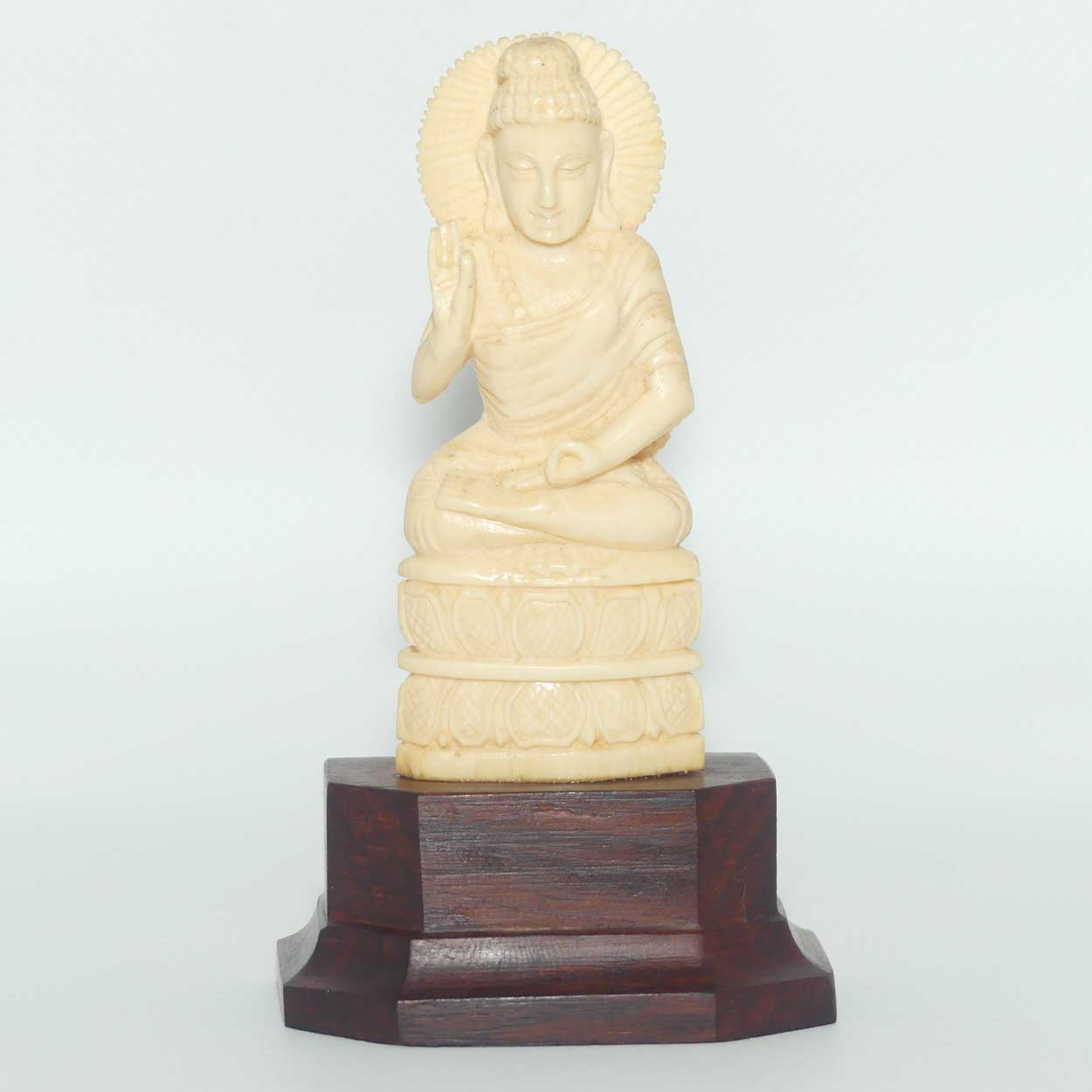 Finely carved Carved Ivory Buddha on Rosewood stand