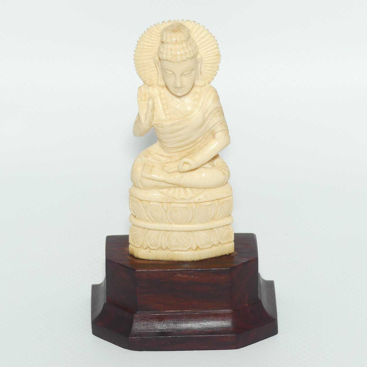 Finely carved Carved Ivory Buddha on Rosewood stand