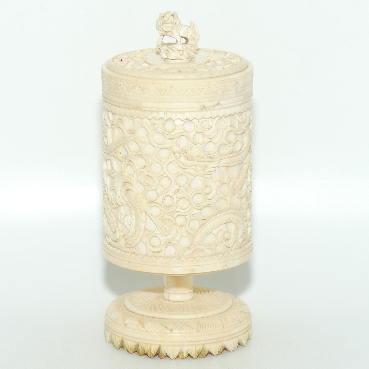 Elaborately carved Ivory lidded pot | Lion finial | Continuous Dragon