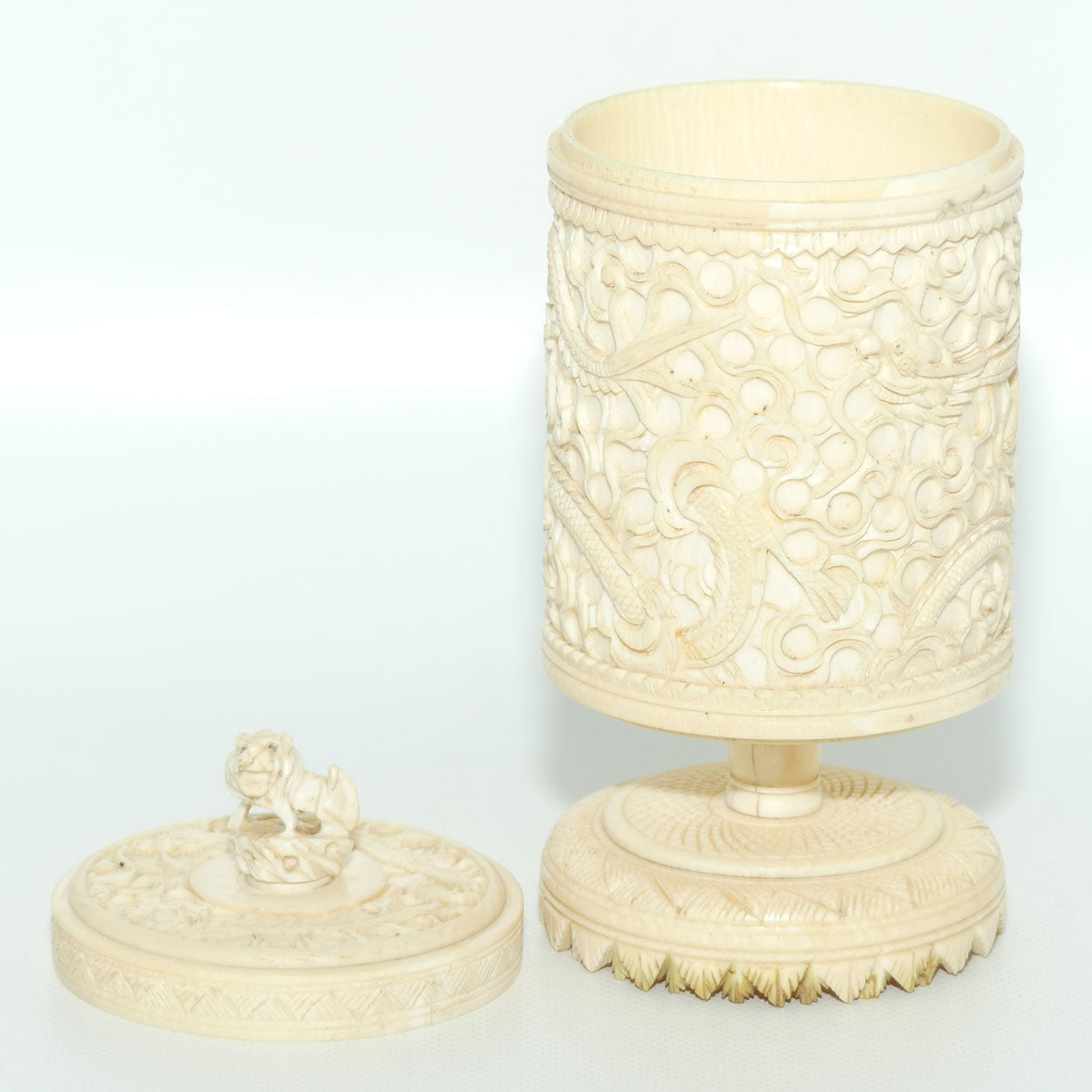 Elaborately carved Ivory lidded pot | Lion finial | Continuous Dragon
