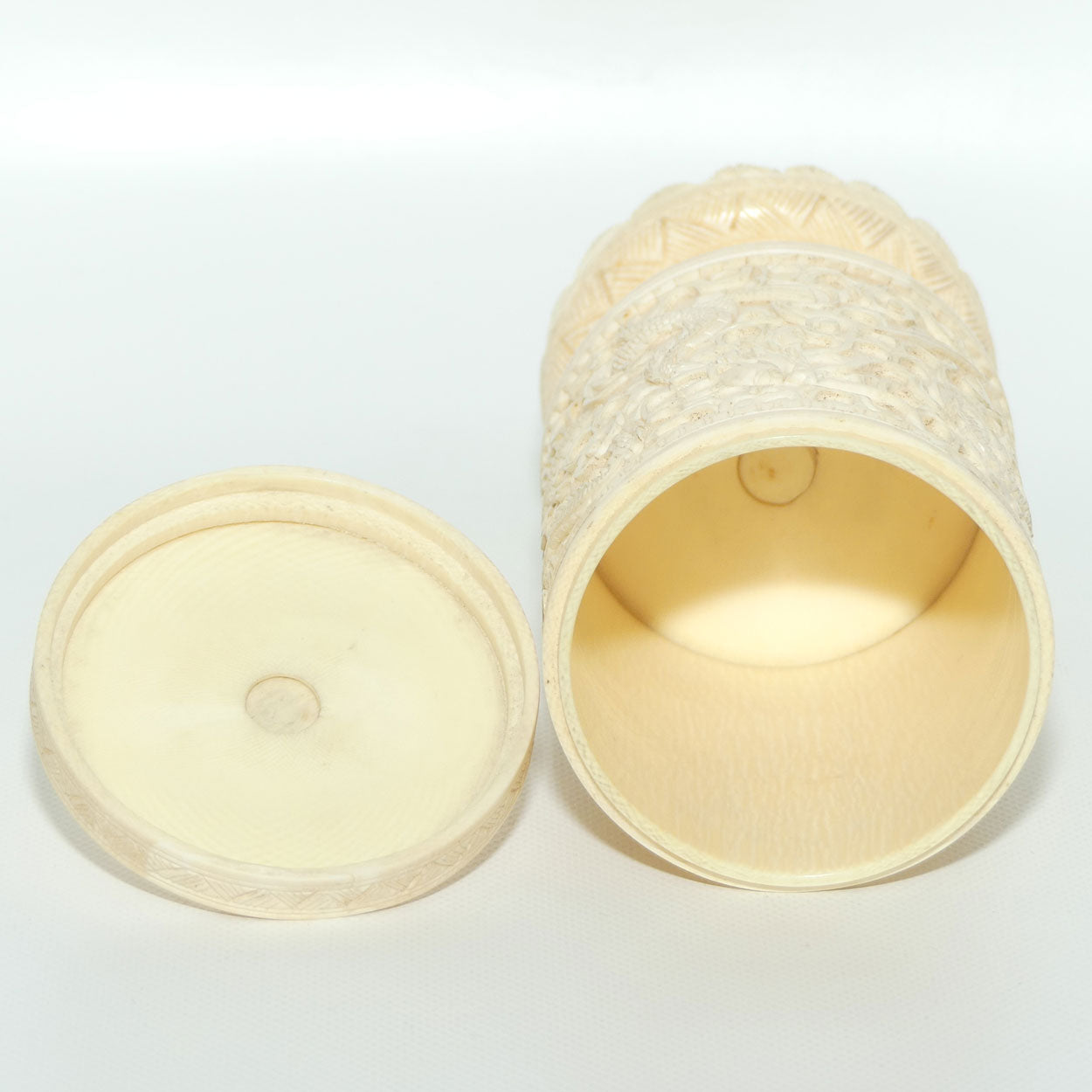 Elaborately carved Ivory lidded pot | Lion finial | Continuous Dragon