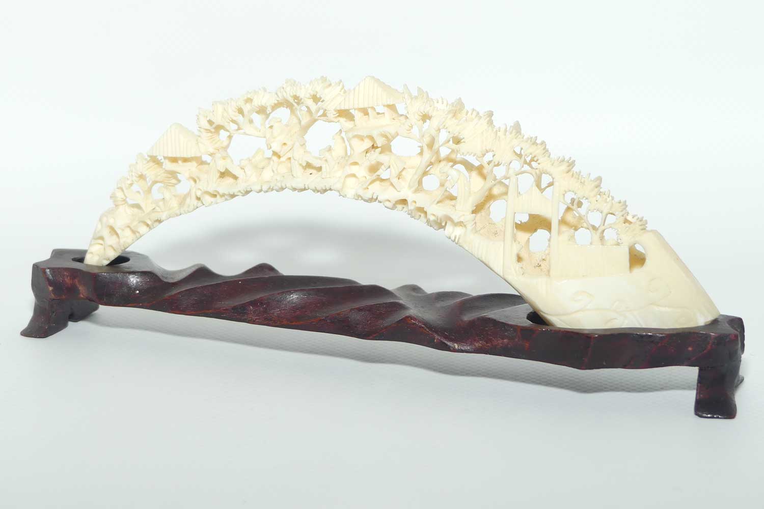 Carved Ivory Tusk depicting Chinese Village on wooden stand | 20cm