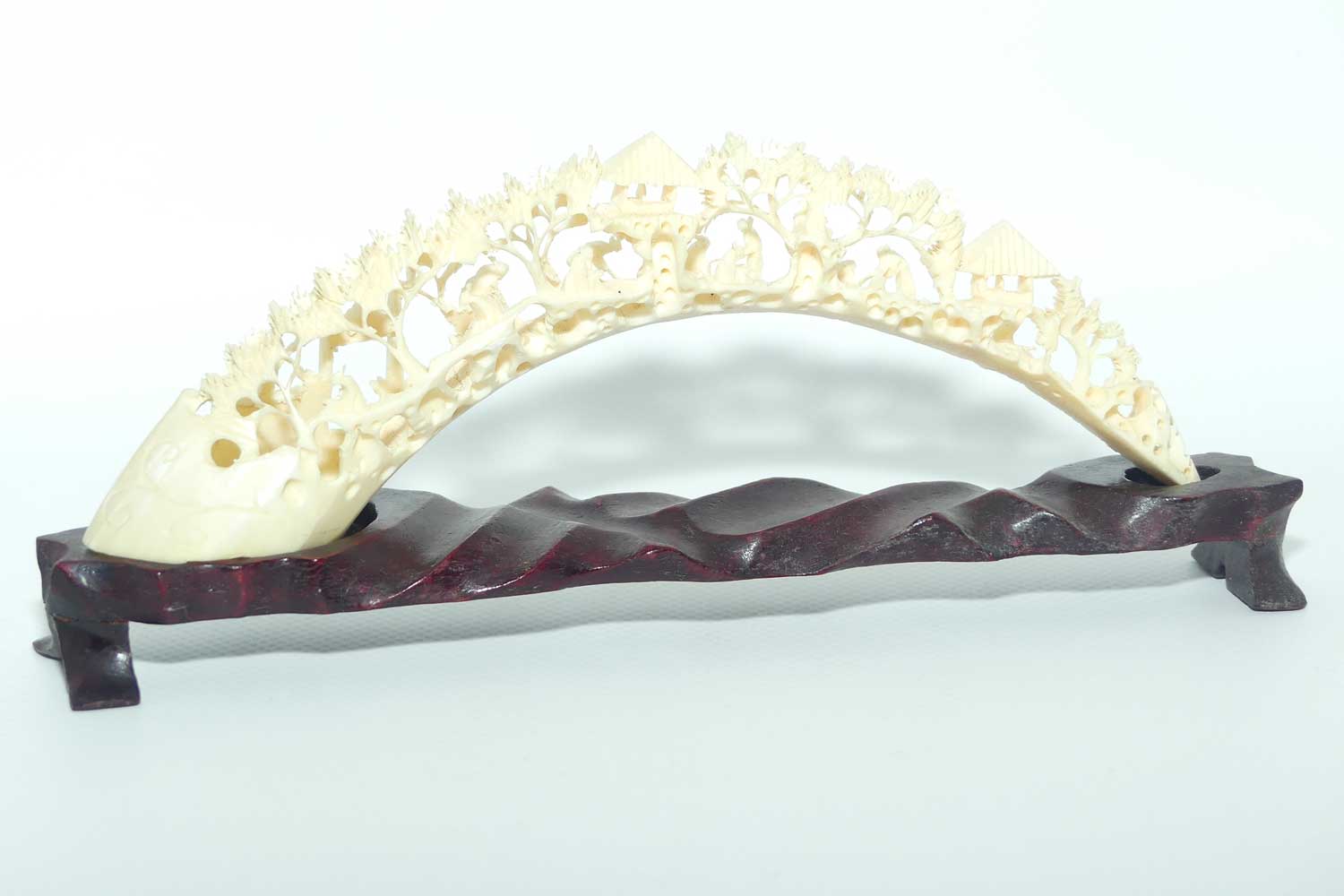 Carved Ivory Tusk depicting Chinese Village on wooden stand | 20cm