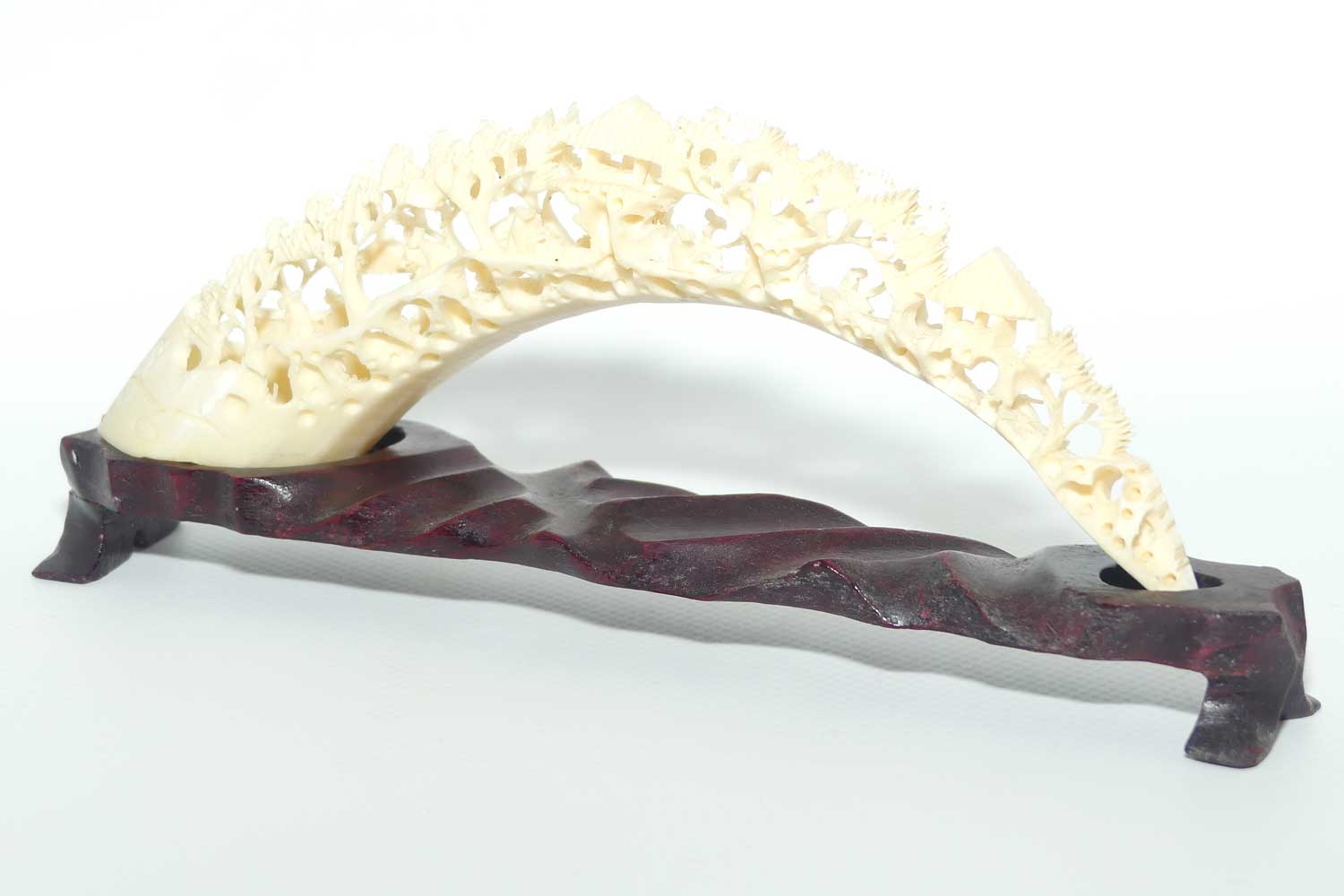 Carved Ivory Tusk depicting Chinese Village on wooden stand | 20cm