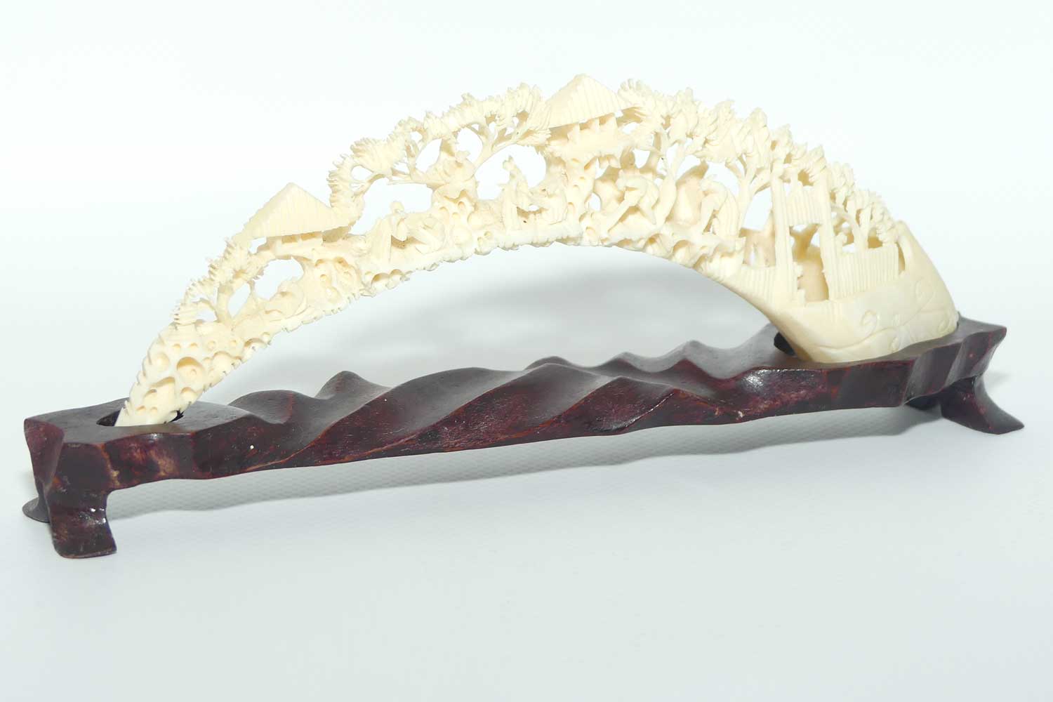 Carved Ivory Tusk depicting Chinese Village on wooden stand | 20cm