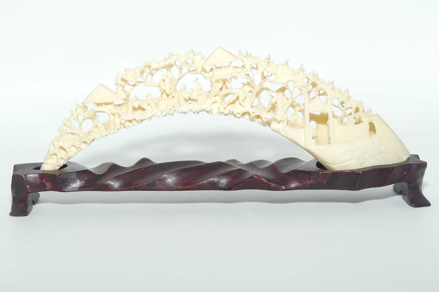 Carved Ivory Tusk depicting Chinese Village on wooden stand | 20cm