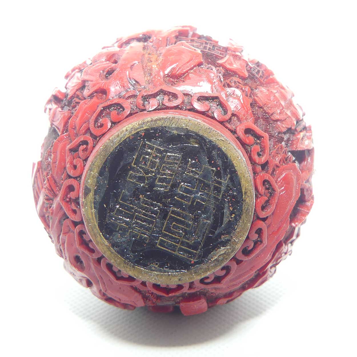 Larger size Cinnabar circular shape snuff bottle | Village and Lake scene